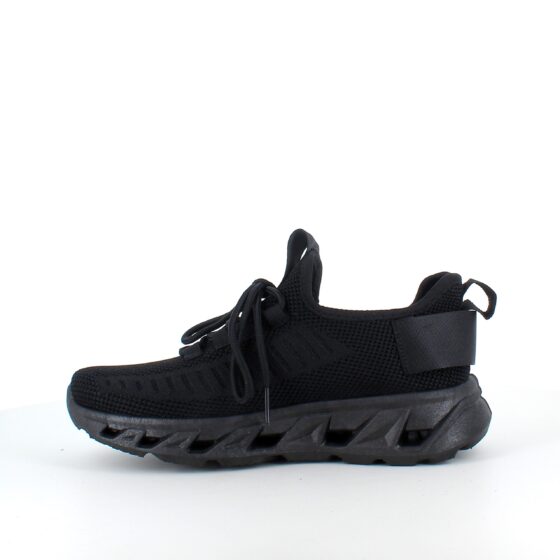 Svart slip-on sko med strikket overdel